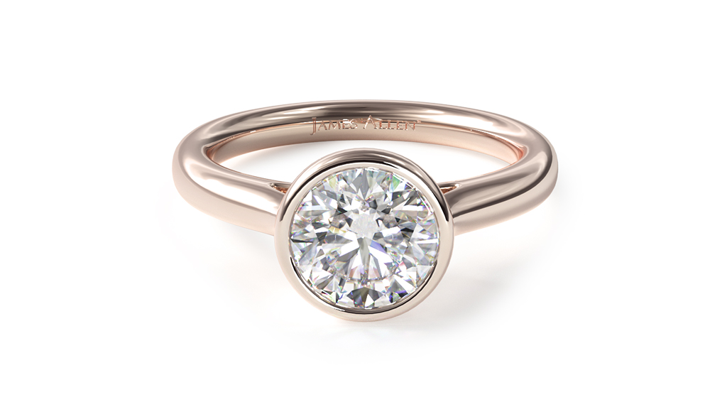 Rose gold engagement ring with bezel set round diamond