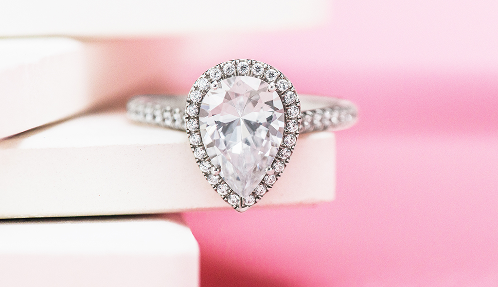 pear-shaped-diamonds-cover-pavé-halo-shank-diamond-engagement-ring