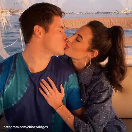 Celebrity engagement rings: Adam DeVine and Chloe Bridges smooching as Chloe shows off her engagement ring.