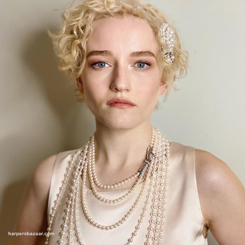 Julia Garner wearing pearl necklace