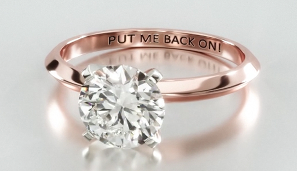 An engraved diamond engagement ring. 