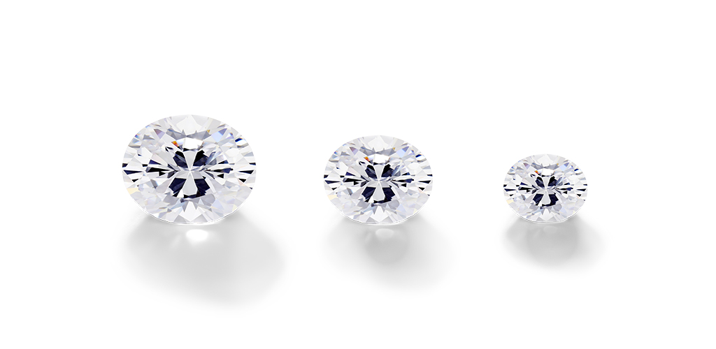 Three different sized oval cut diamonds