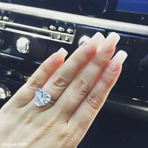 Lady Gaga taking a ring selfie of her heart-shaped engagement ring 
