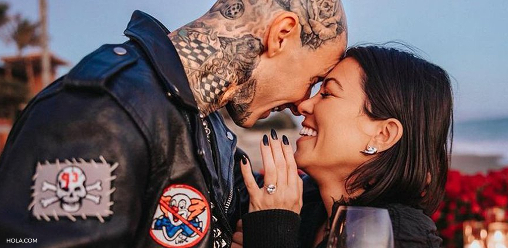 Kourtney Kardashian and Travis Barker smiling after the proposal. 