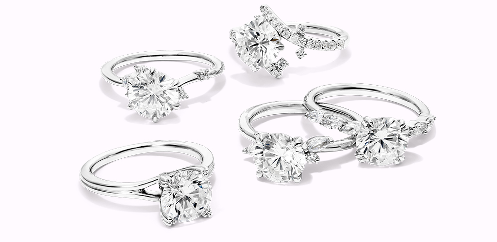 Several diamond engagement rings with different settings 