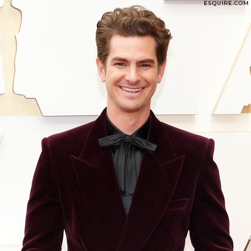 Andrew Garfield posing on the 2022 Oscars red carpet 