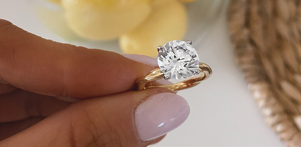 a yellow gold solitaire ring 