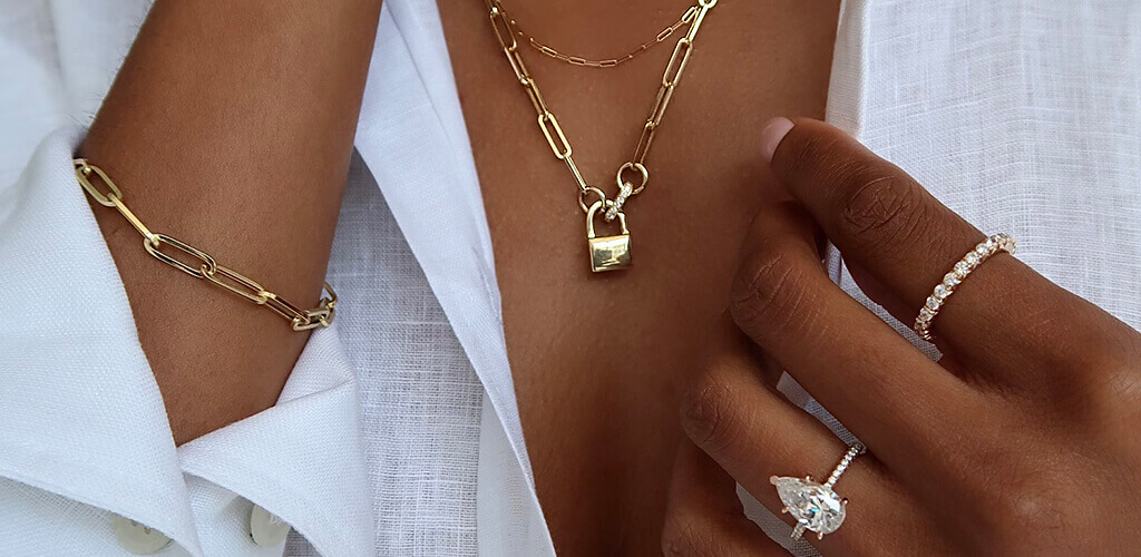 A model wearing an array of gold jewelry