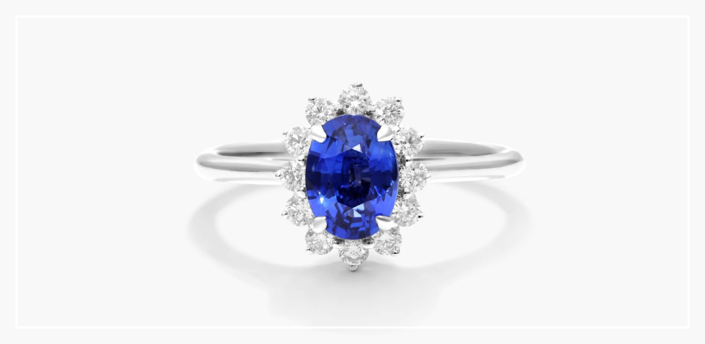 An oval sapphire ring with a diamond halo.