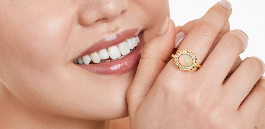 A woman wearing an opal ring