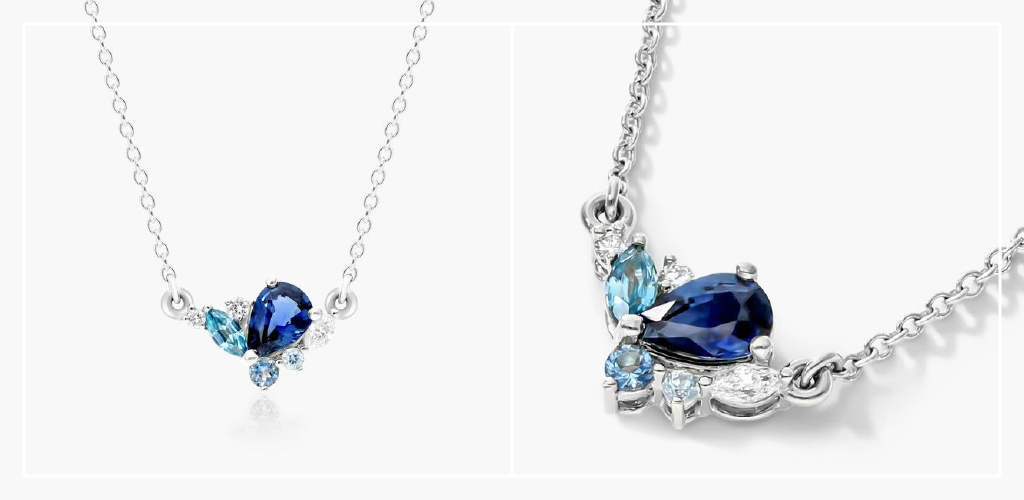A photo of a James Allen white gold sapphire, blue zircon, and diamond cluster necklace
